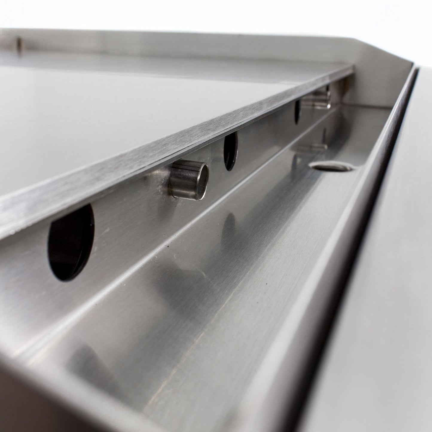 Close-up of the Blaze 30-inch natural gas griddle’s removable grease tray, allowing for effortless grease collection and maintenance